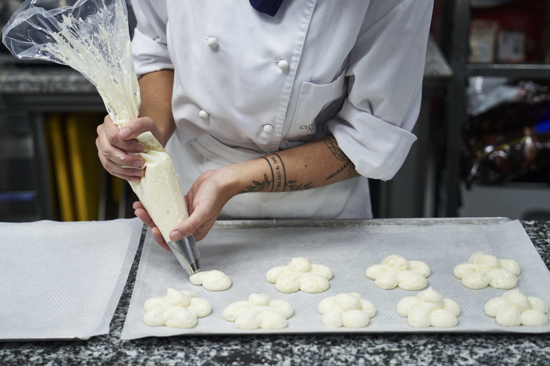 A pastry chef making cookies