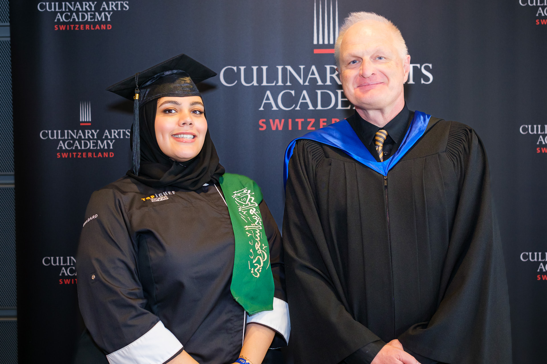A CAAS professor with a recent culinary arts bachelor degree graduate