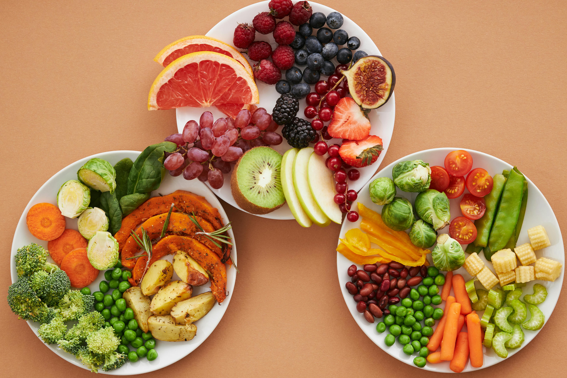 Plates full of fruit and vegetables