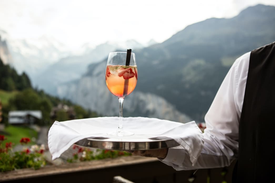 Waiter serving a cocktail